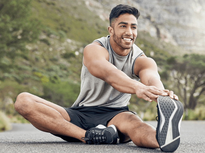 Runner stretching joints before a run